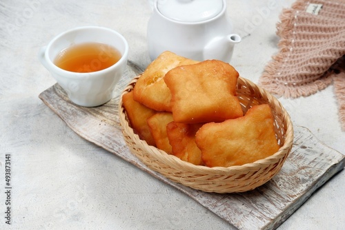 odading or beignet, indonesian fried bread on white background photo