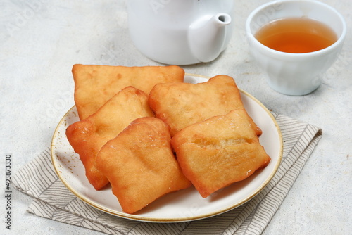 odading or beignet, indonesian fried bread on white background photo