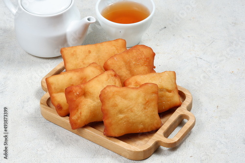 odading or beignet, indonesian fried bread on white background photo