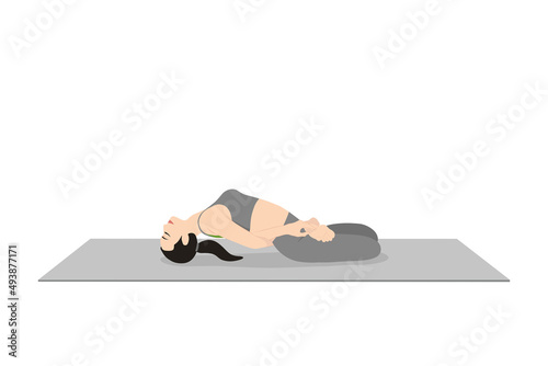 Reclined Bound Lotus Pose. Beautiful girl practice Supta Baddha Padmasana. Young attractive woman practicing yoga exercise. working out, black wearing sportswear, grey pants and top, indoor full