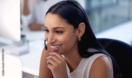 Another day another problem solved. Shot of a young woman working in a call center. Free Download Another day another problem solved. Shot of a young woman working in a call center. - GFXLoad