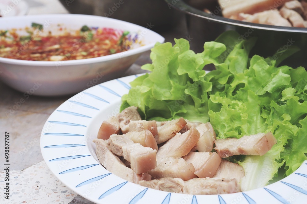 Bossam korean boiled pork wraps chili spicy sauce