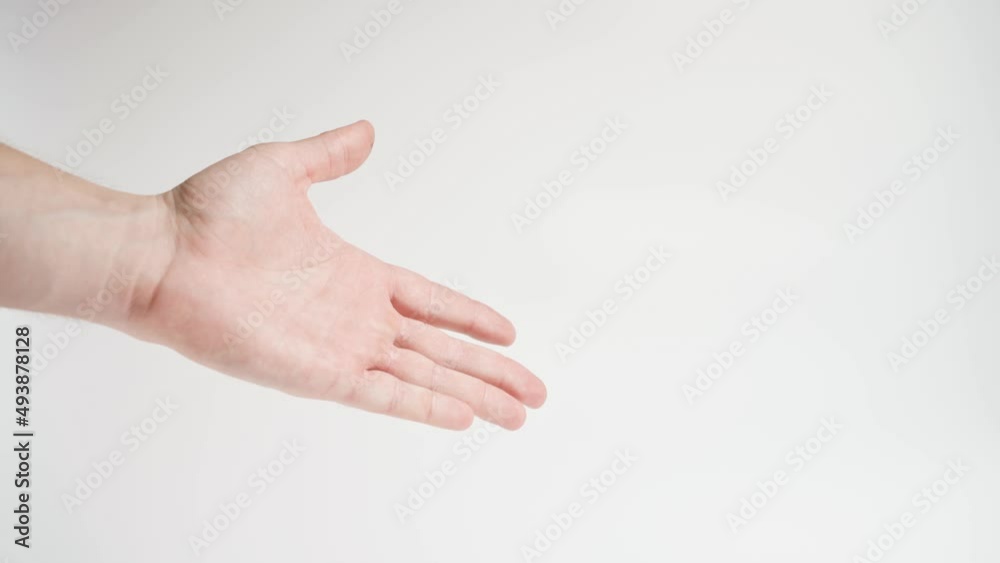 Man's hand showing a gesture of welcome and handshake on a white background Man's hand showing a gesture of welcome and handshake on a white background