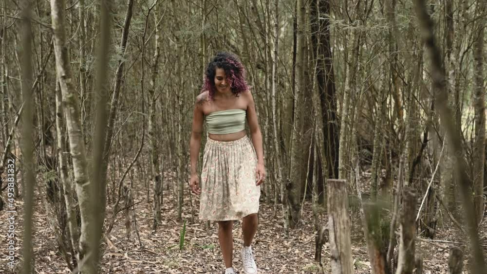 Woman seen walking in forest during fall Woman seen walking in forest during fall