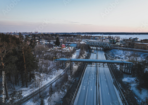 Car road in a small town. Aerial view. Urban scene in winter