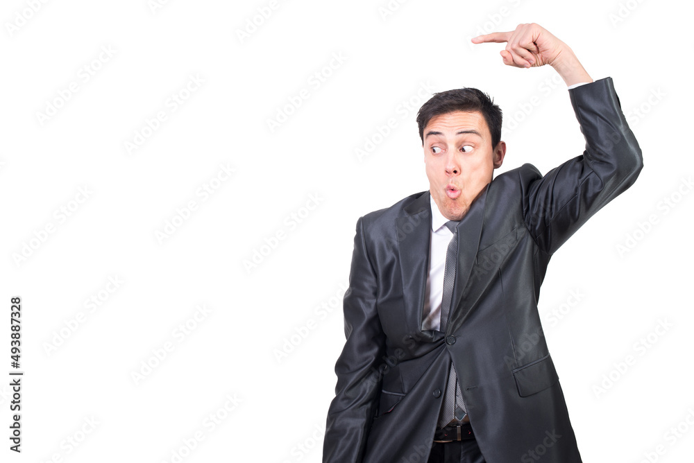 Surprised man in suit pointing aside in studio Surprised man in suit pointing aside in studio