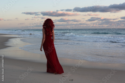 Tableau sur toile Full length portrait of  redhead woman wearing elegant gown