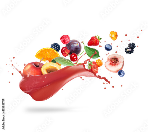 Different fruits and berries in splashes of juice isolated on a white background