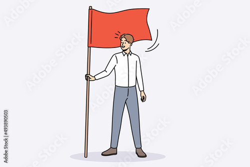 Happy young businessman hold flag demonstrate goal achievement. Smiling male employee or worker show leadership and motivation. Aim accomplishment and success. Vector illustration. 