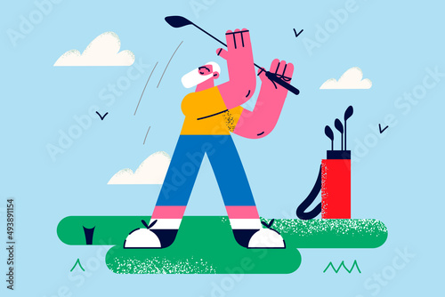 Smiling senior man play golf on court