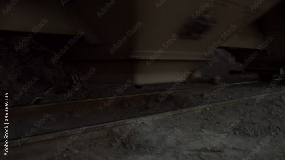 Train wheels moving over railroad tracks alongside the country. Train wheels moving over railroad tracks alongside the country.