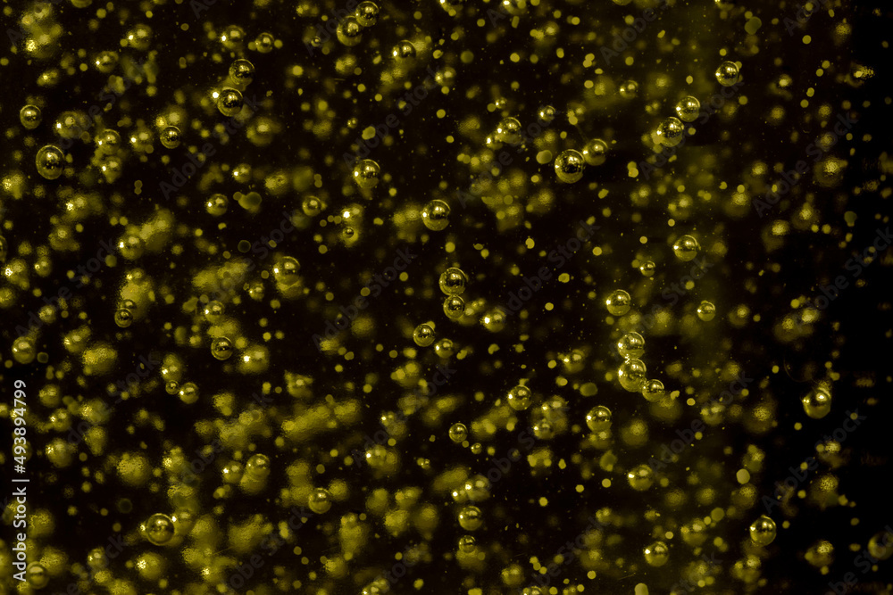 Randomly scattered air bubbles close-up, macro. Silvery metallic balls of mercury