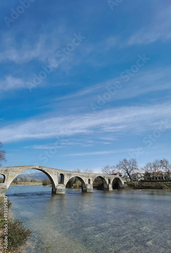 arta city old arched bridge of stones through arahthos river greece