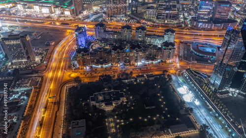 Bussy traffic on the roads and intersection in Dubai downtown aerial night timelapse. © neiezhmakov