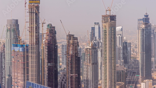 Dubai downtown with large-scale construction of a residential complex with a view of construction cranes aerial timelapse