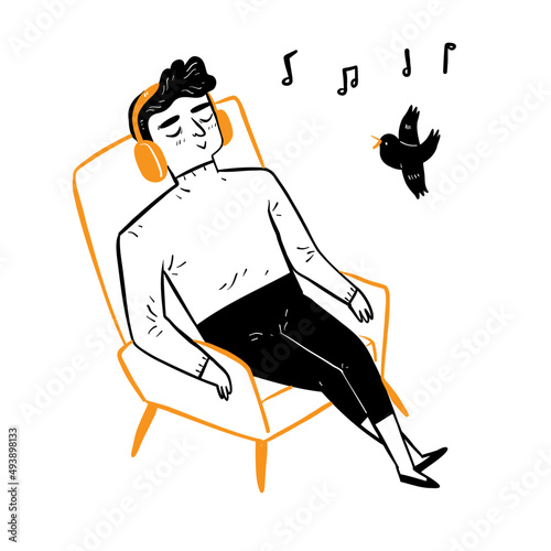 Young man sleeping on a chair listen to music through headphones.