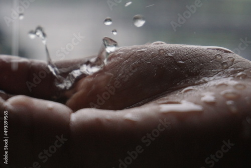 rain water splash in hand 