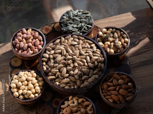 Bowl with pistachios, hazelnut, peanuts, almonds, cashews,sunflower seeds, top view