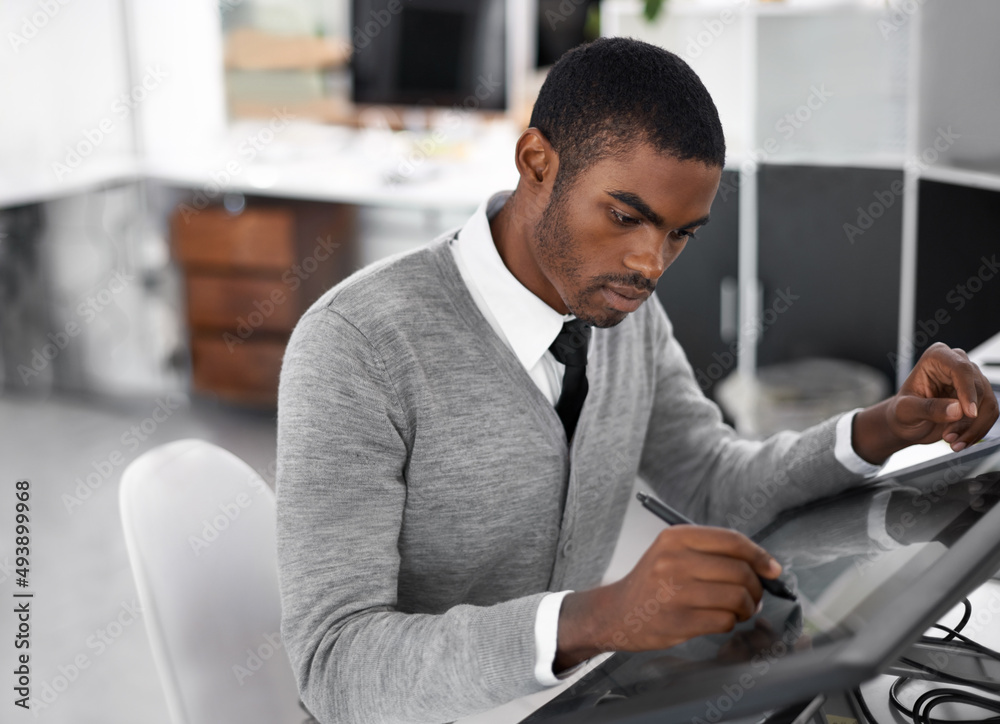 Smart technology makes everything easier. A young man working on a large touchscreen. Smart technology makes everything easier. A young man working on a large touchscreen.