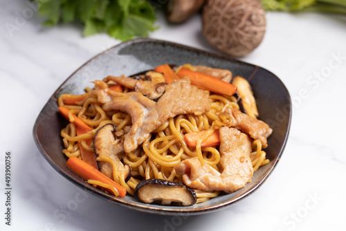 Udon stir fry noodles teriyaki sauce with pork meat and vegetables shiitake mushrooms