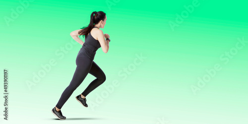 Young woman exercising with run gesture on studio