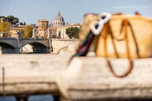 Landscape of Tiber river at sunny morning in Rome. Dome of famous saint Peter basalica on the skyline. Traveling Italy photo