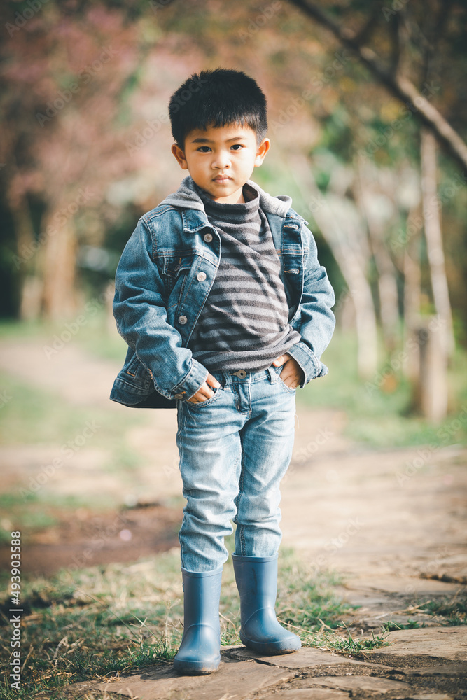 Indian Boy In Blue Jeans And Black Goggle Front Pose Stock Photo, Picture  and Royalty Free Image. Image 74578309.
