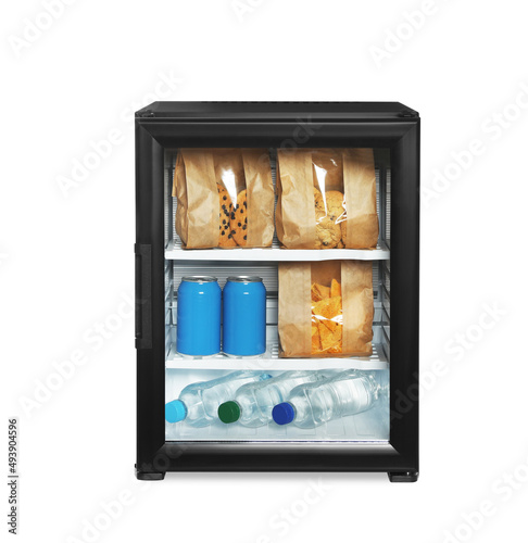 Mini bar filled with food and drinks isolated on white photo