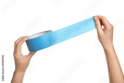 Woman holding light blue adhesive tape on white background, closeup