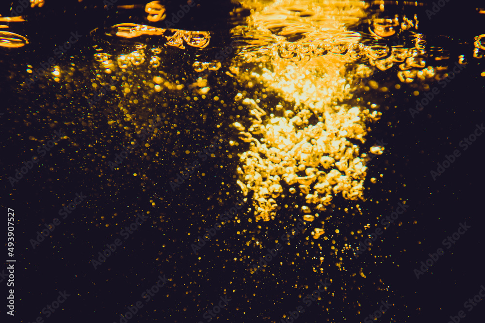 Gold bokeh from water of lights  with black background