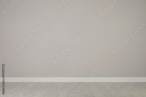 Blank light grey wall in room. Space for design