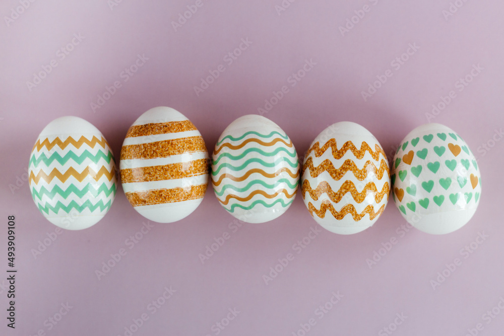 Easter eggs in pastel colors with a pattern on a pink background. Easter eggs in pastel colors with a pattern on a pink background.