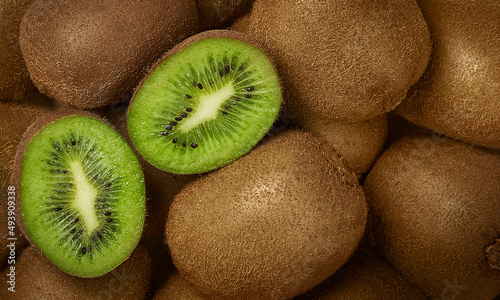 Organic delicious fresh kiwi whole and slice background for farming packaging advertising 