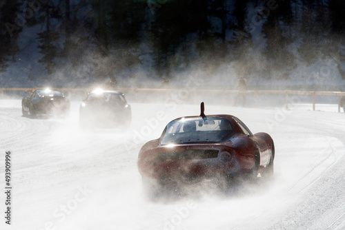 Classic vintage car on the frozen lake of Saint Moritz in a race photo