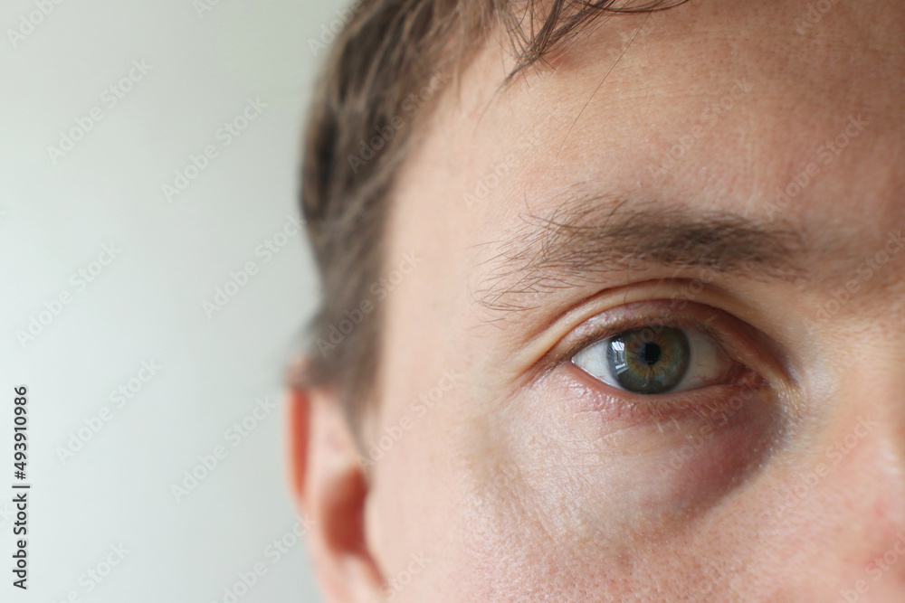 Obraz premium Young Man Eye Half Face