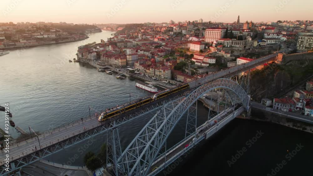 famous Portuguese tourist destination, the city of Porto at sunset in golden light with Luis I bridge and Douro river, aerial view famous Portuguese tourist destination, the city of Porto at sunset in golden light with Luis I bridge and Douro river, aerial view