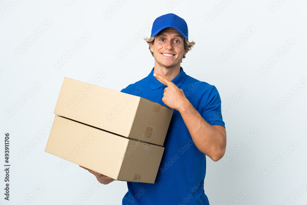 Delivery man over isolated white background pointing to the side to present a product Delivery man over isolated white background pointing to the side to present a product