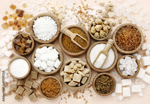 Mix of sugar varieties: unbleached, brown and white, refined and unrefined, granulated and cubes © ulada