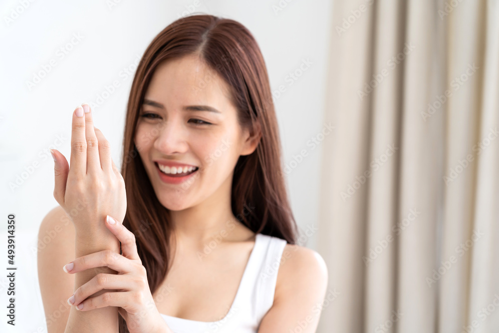 Portrait of smiling cheerful beautiful pretty asian woman clean fresh healthy white skin posing smile in pajamas white clothes.Girl felling relax and enjoy time on the bed at home.asia beauty Portrait of smiling cheerful beautiful pretty asian woman clean fresh healthy white skin posing smile in pajamas white clothes.Girl felling relax and enjoy time on the bed at home.asia beauty