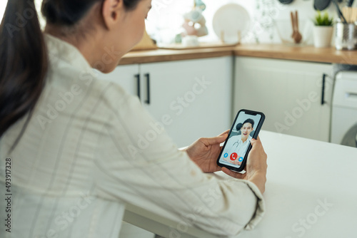 Asian young woman patient talking virtual online with medical doctor. 