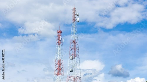 Time lapse of telecom pole with clouds moving photo