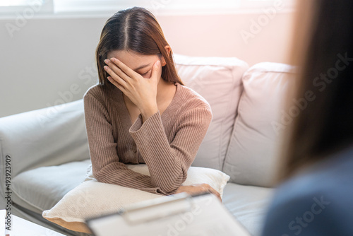 Stressed Asian teens are treated by a psychologist or psychiatrist in a psychiatric clinic or hospital. Patients reported symptoms of depression, stress, irritability, and life problems.