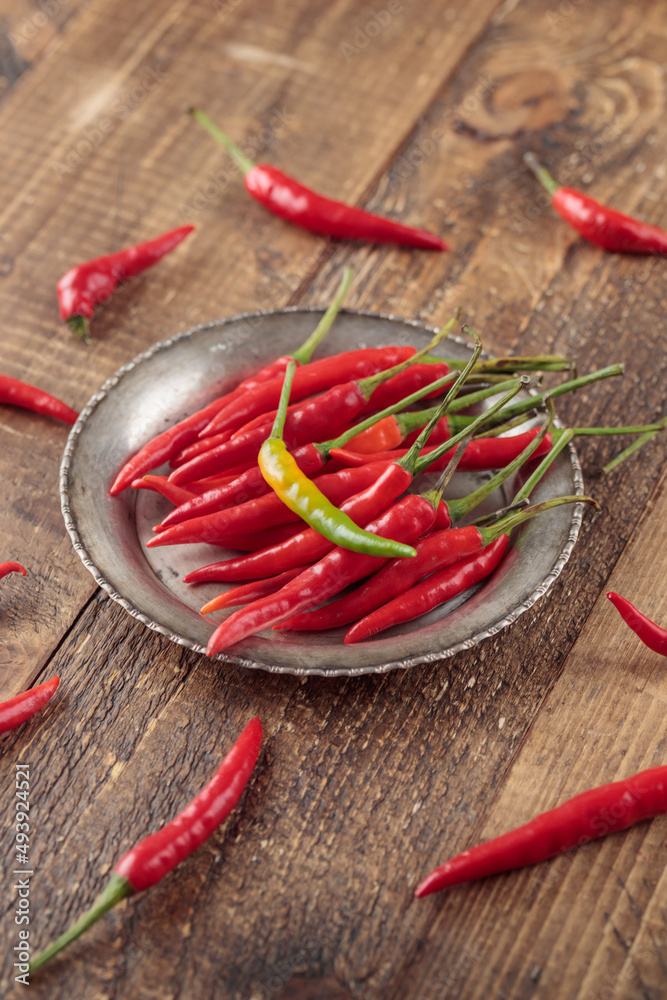 Red hot chili peppers on wooden background Red hot chili peppers on wooden background