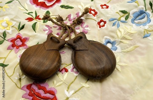 Spanish castanets, typical musical instrument of Spanish folklore, typical of the Aragonese jota on a background of a classic manila manton photo