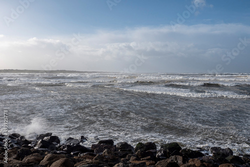 Powerful ocean waves. Strandhill, county Sligo, Ireland. Cloudy sky. © mark_gusev