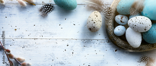  Art Easter background with Easter eggs on white table