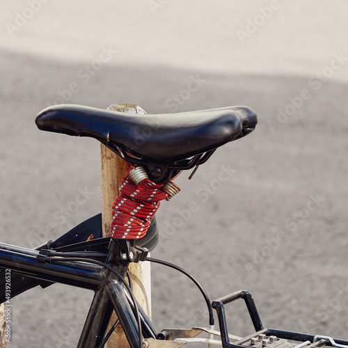 Fototapeta Naklejka Na Ścianę i Meble -  bicycle seat on the street, bicycle mode of transportation