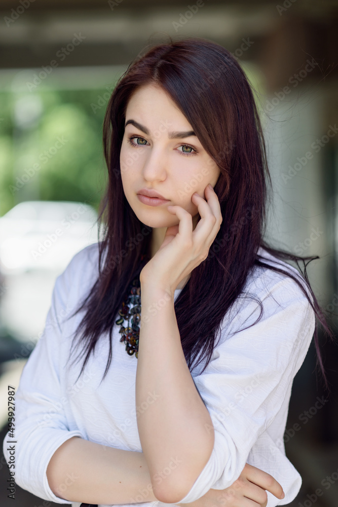 Summer portrait of beautiful young woman with dark hair. Summer portrait of beautiful young woman with dark hair.