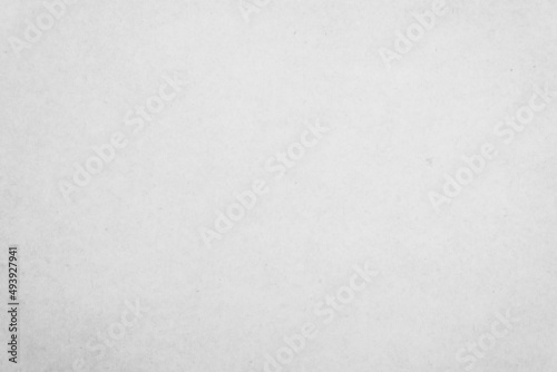 White recycled craft paper texture as background. Grey paper texture, Old vintage page or grunge vignette cardboard.