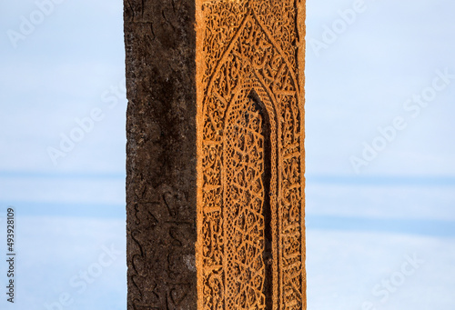 Historical Ahlat Seljuk Square Cemetery with islamic tombstones during winter under snow